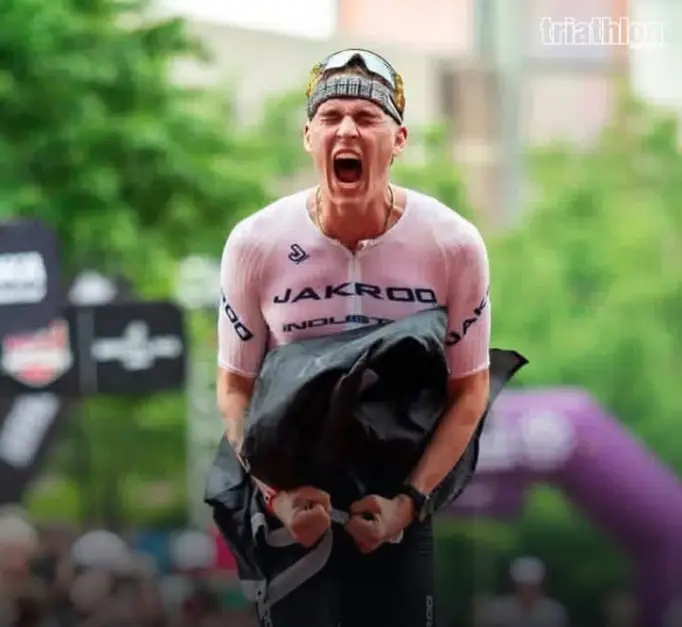 Brock Hoel celebrating after an Ironman