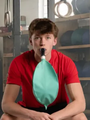 young man using Isocapnic BWB lung trainer